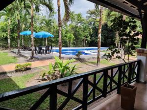 a view from the balcony of a resort with a swimming pool at Casa Montenegro in Villavicencio
