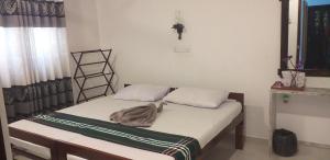 Letto o letti in una camera di VILLA No34 HIKKADUWA