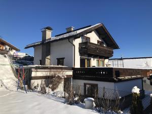 a house with snow on the ground in front of it at Haus Anemone in Seefeld in Tirol +2 photos