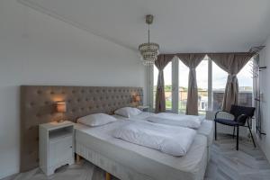 Postel nebo postele na pokoji v ubytování Strandleven appartement 201 - Groote Keeten