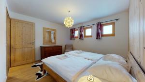 Voodi või voodid majutusasutuse Modern chalet surrounded by nature in Vercorin toas