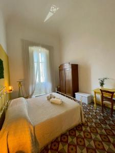 Posteľ alebo postele v izbe v ubytovaní 4 Balconi House-Appartamento salentino nel centro di Lecce