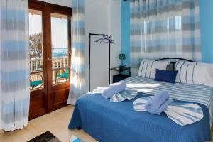 Posteľ alebo postele v izbe v ubytovaní Maras Marinas Home