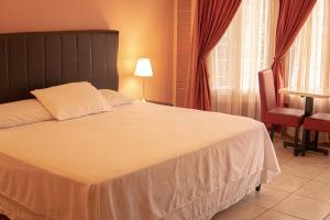 Orquidea Limon Hotel Boutique房間的床