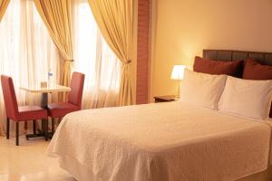 Orquidea Limon Hotel Boutique房間的床