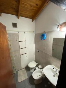 a bathroom with a sink and a toilet at Espacio Mar in Posadas