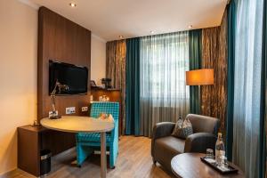 TV a/nebo společenská místnost v ubytování Hotel Residenz Passau