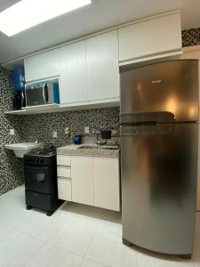 Kuchyň nebo kuchyňský kout v ubytování Muro Alto Clube Residence