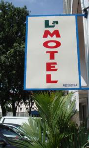 a sign on the side of a building at LA MOTEL in Sungai Petani +5 photos
