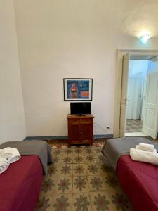 Posteľ alebo postele v izbe v ubytovaní 4 Balconi House-Appartamento salentino nel centro di Lecce
