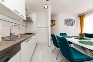 Kuchyňa alebo kuchynka v ubytovaní Apartman 1 Paola