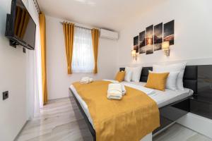 Posteľ alebo postele v izbe v ubytovaní Apartman 1 Paola