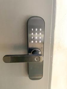 a metal door handle with a lock on a door at Apartament IV piętro in Ustka