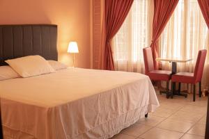 Orquidea Limon Hotel Boutique房間的床
