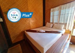 Postel nebo postele na pokoji v ubytování Ever Green Guest House - SHA Plus