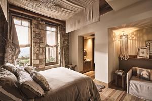 Voodi või voodid majutusasutuse Area Synest Nature Suites toas