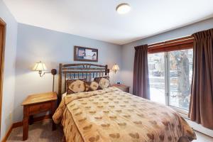 a bedroom with a bed and a large window at The Seasons H23 in Dover +71 photos