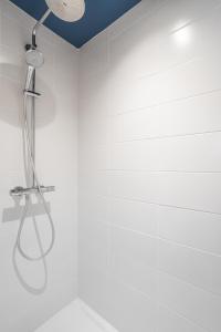 a bathroom with a shower with a shower head at ARNEM - cosy T3 in Rennes