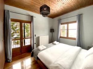 Ένα ή περισσότερα κρεβάτια σε δωμάτιο στο Pavliani House