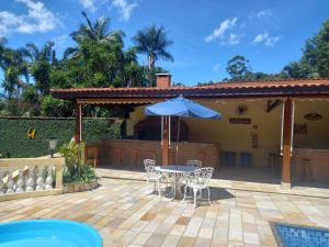 Swimmingpoolen hos eller tæt på Pousada Casa Amarela