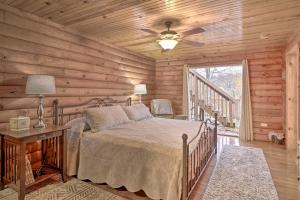 a bedroom with a bed and a ceiling fan at Woodsy Kentucky Escape with Game Room and Lake Access! in Burnside