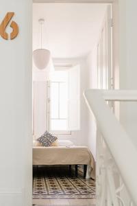 Letto o letti in una camera di Mapango Small Rooms