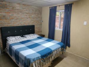 Una cama o camas en una habitación de LA CASA DE ANDREA Y DAVID II Dirección nueva en Santa Ana a 20 kilom del Paso