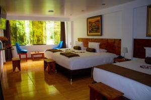Voodi või voodid majutusasutuse Hotel Tara Machupicchu toas
