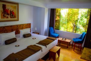 Voodi või voodid majutusasutuse Hotel Tara Machupicchu toas