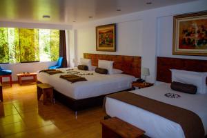 Voodi või voodid majutusasutuse Hotel Tara Machupicchu toas