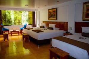 Voodi või voodid majutusasutuse Hotel Tara Machupicchu toas