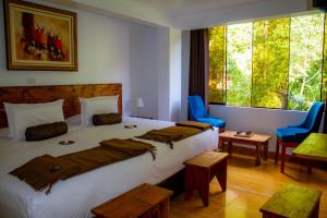 Voodi või voodid majutusasutuse Hotel Tara Machupicchu toas