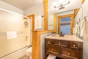 A bathroom at Hotel Style Room in The Timber Creek Lodge condo
