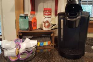 a kitchen counter with a coffee maker and a mixer at Cabin 2 - Modern Cabin Rentals in Southwest Mississippi at Firefly Lane in Summit