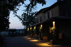 a building with lights on the side of it at Podere Sette Piagge in Orvieto