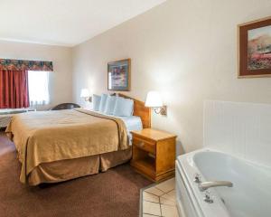 A bed or beds in a room at GreenTree Inn Denver Tech Center