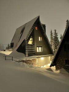 a house in the snow with snow covered at Casa Valley Paradiso - Jahorina in Jahorina