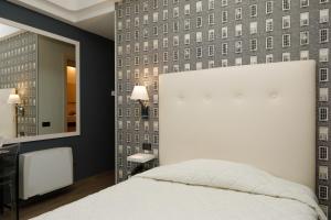 Posteľ alebo postele v izbe v ubytovaní Hotel Lancaster