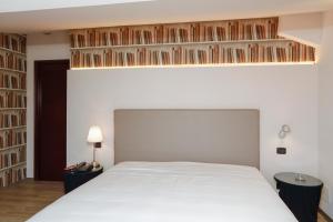 Posteľ alebo postele v izbe v ubytovaní Hotel Lancaster