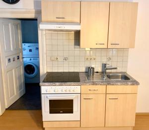 Kuchyňa alebo kuchynka v ubytovaní Mellow City Apartment - by Nahuen Suites + 15 fotografií