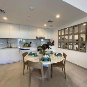 a dining room with a table and chairs in a kitchen at Madinat Jumeirah Living - Lamtara 2 in Dubai