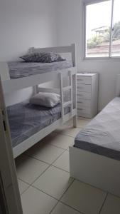 Giường trong phòng chung tại Club Vista do Atlântico