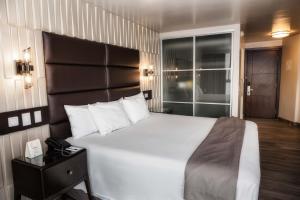 Cama ou camas em um quarto em Plaza Paitilla Inn