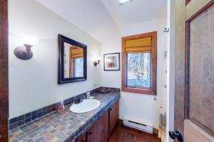 a bathroom with a sink and a mirror at 375 Hawk Spur in Plymouth +46 photos