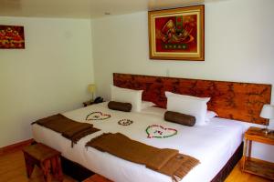 Voodi või voodid majutusasutuse Hotel Tara Machupicchu toas