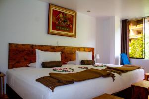 Voodi või voodid majutusasutuse Hotel Tara Machupicchu toas