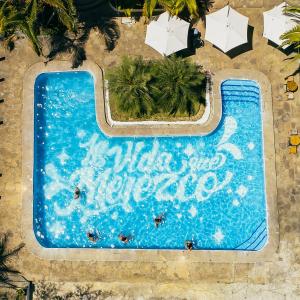an overhead view of a swimming pool with umbrellas at CasaBosque in Tarapoto