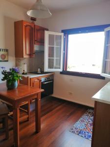 a small kitchen with a table and a window at Villa La Victoria in Tegueste +18 photos