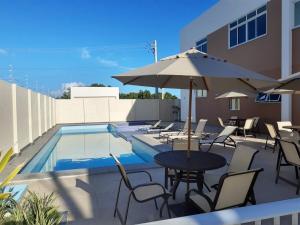 The swimming pool at or close to Vento do Mar - Em frente à PRAIA dos Milionários