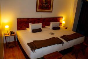 Voodi või voodid majutusasutuse Hotel Tara Machupicchu toas